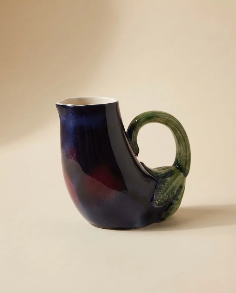AI-generated aubergine ceramic jug photography: studio front