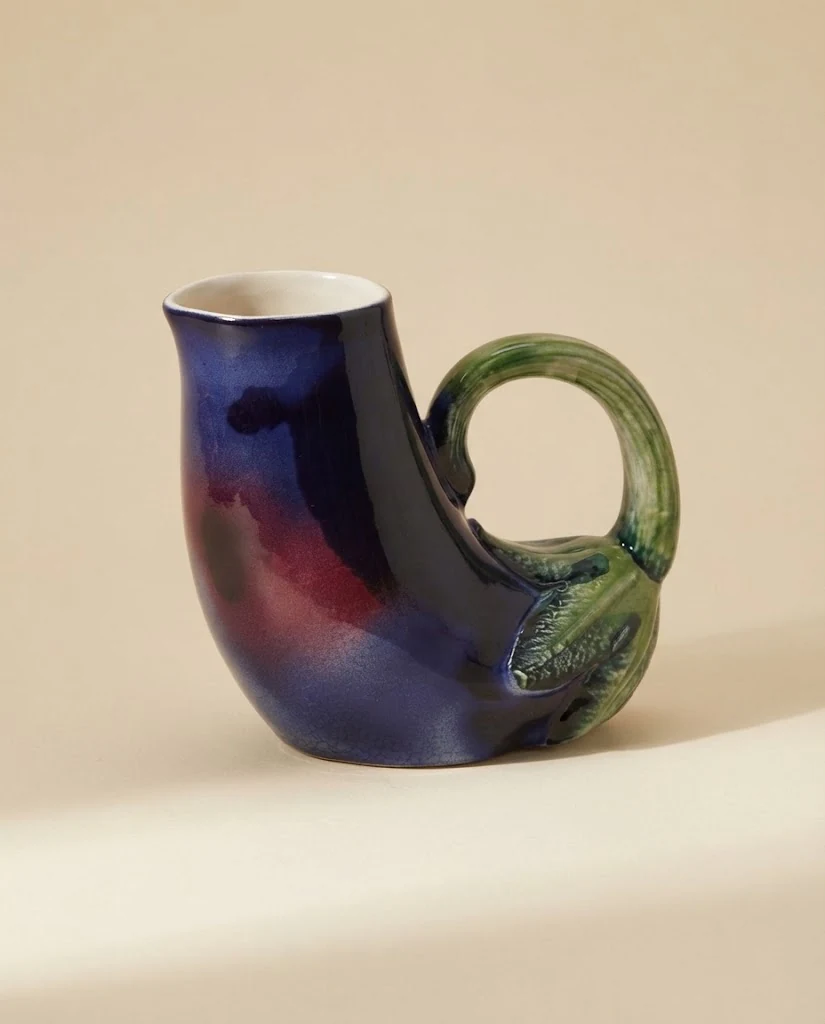 AI-generated aubergine ceramic jug photography: studio angle