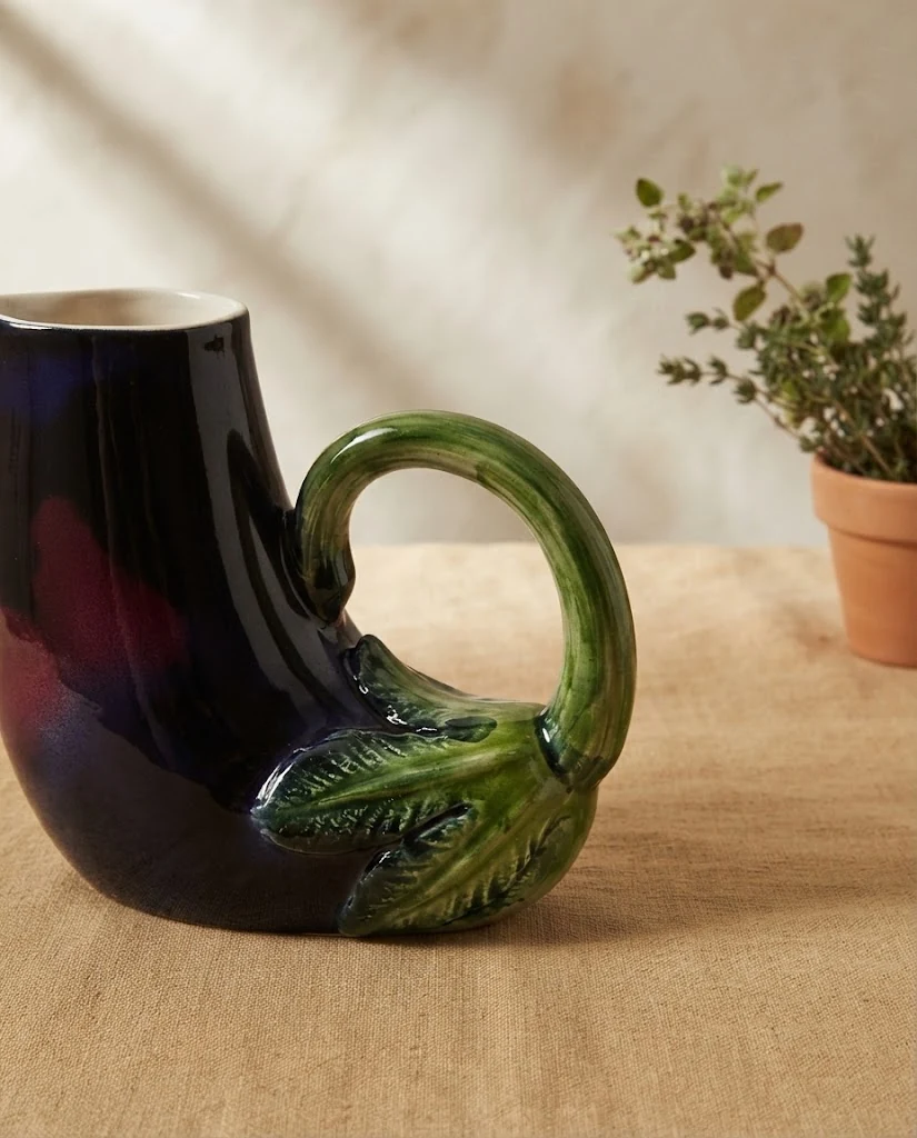 AI-generated aubergine ceramic jug photography: glaze & handle
