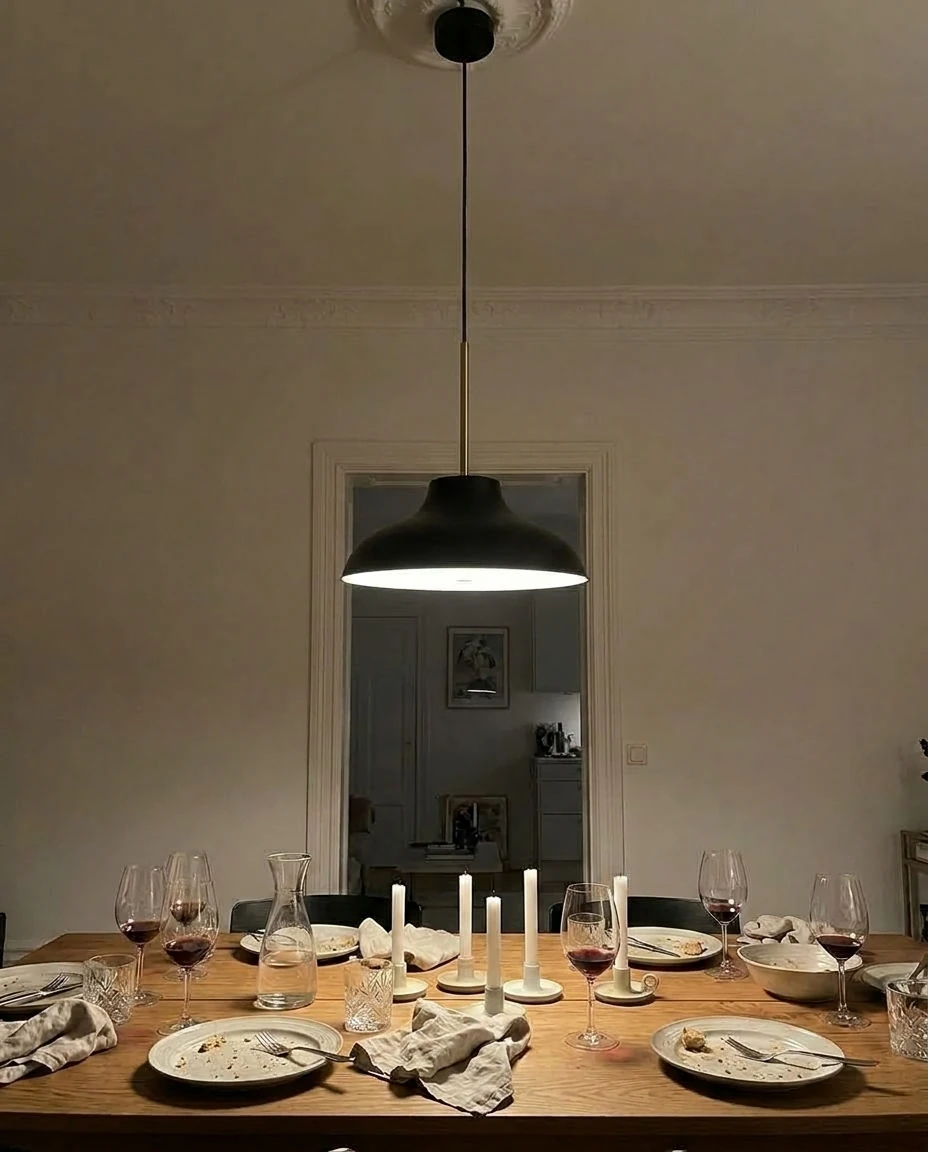 AI-generated black and brass pendant photography: after dinner