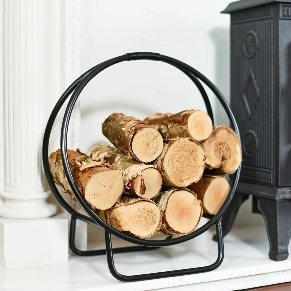 Original reference photograph of Black hoop log holder