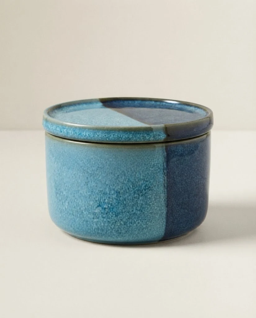 AI-generated blue glaze storage jar photography: studio hero