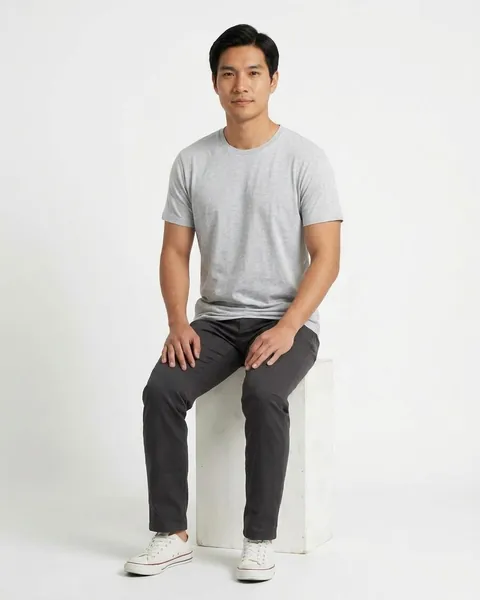 Fictional AI model Kai — seated view in a neutral studio