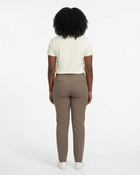 Fictional AI model Maya — back view in a neutral studio