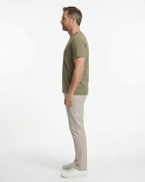 Fictional AI model Theo — side view in a neutral studio