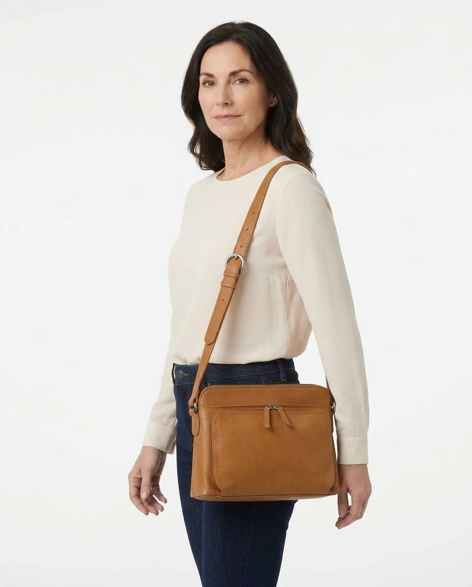 AI-generated saddle leather crossbody photography: on-model angle