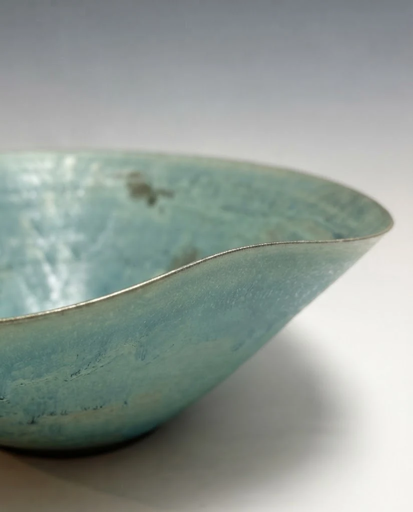 AI-generated sea-green wave bowl photography: rim & glaze