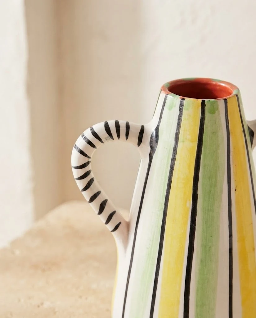 AI-generated striped ceramic vase photography: glaze & handle